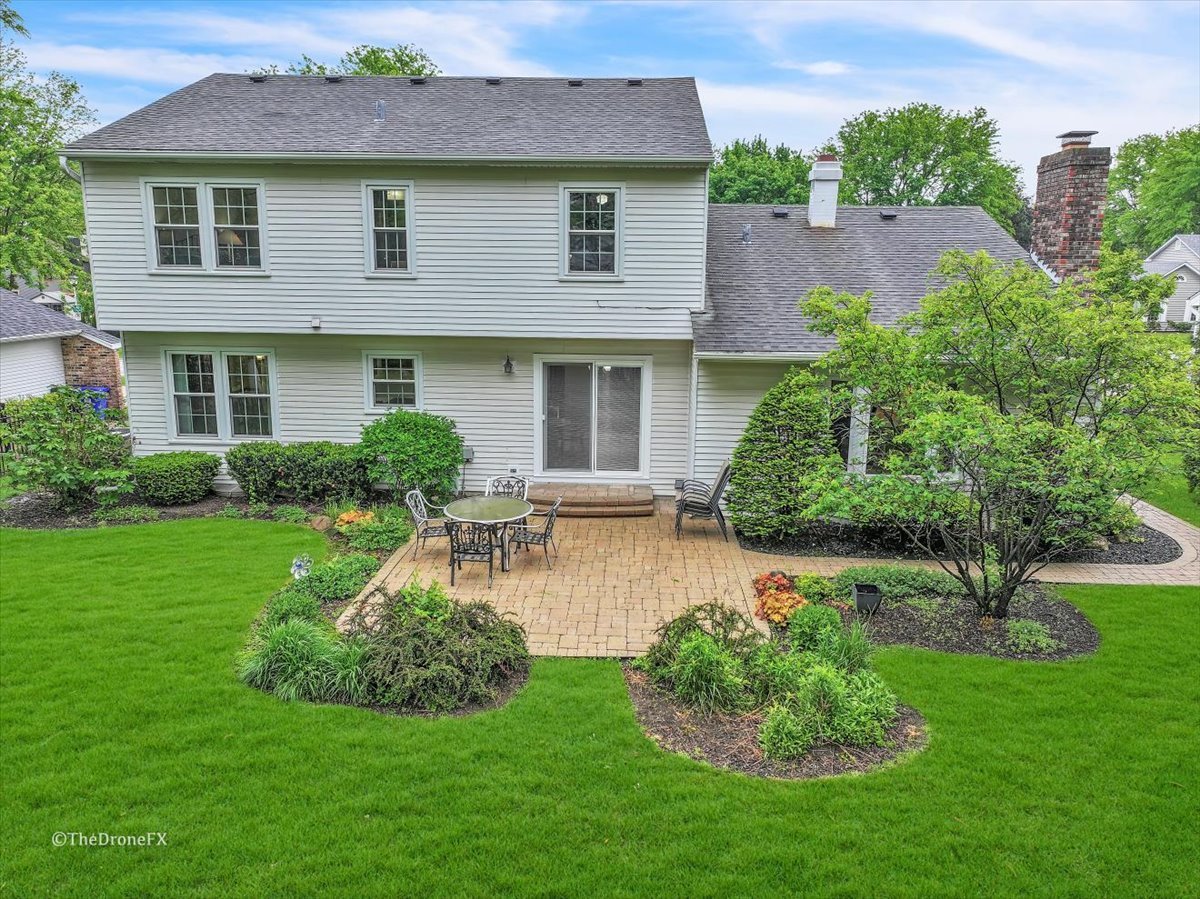 659 Brighton Drive Wheaton, IL 60189 - Photo 25 of 25 a view of a house with a yard and plants