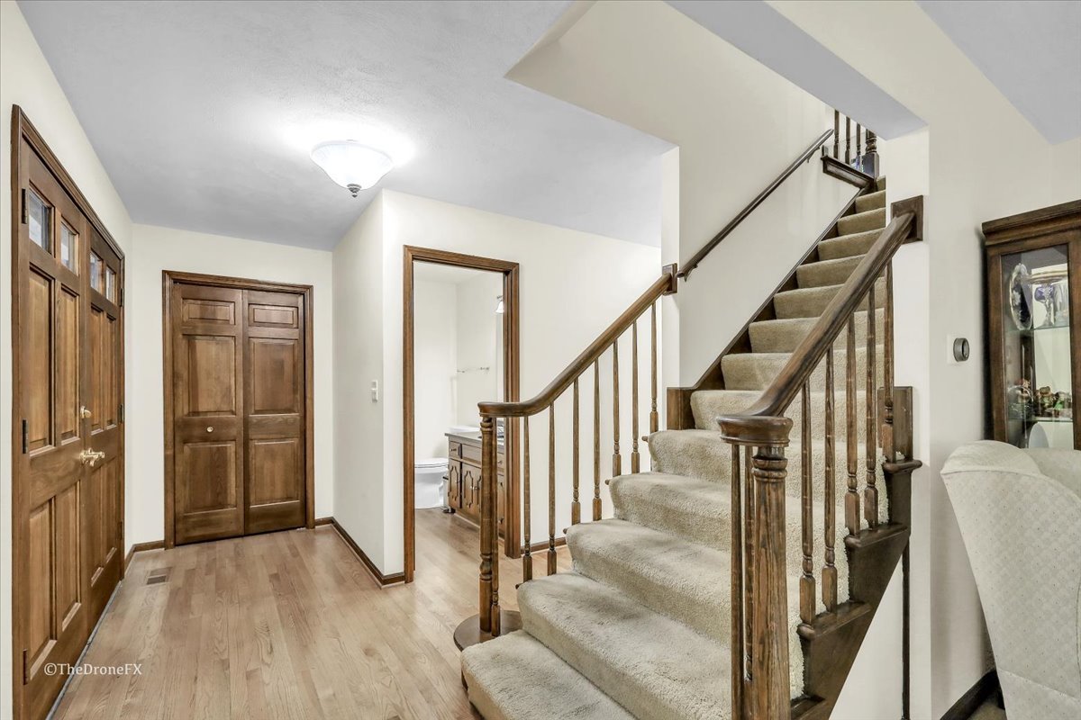 659 Brighton Drive Wheaton, IL 60189 - Photo 6 of 25 a view of an entryway with wooden floor and door