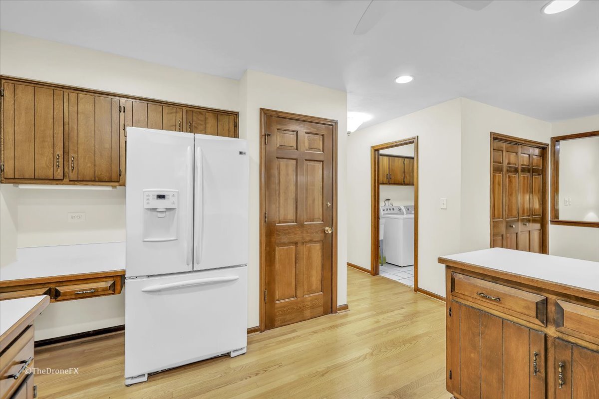 659 Brighton Drive Wheaton, IL 60189 - Photo 10 of 25 a white refrigerator freezer sitting in a kitchen
