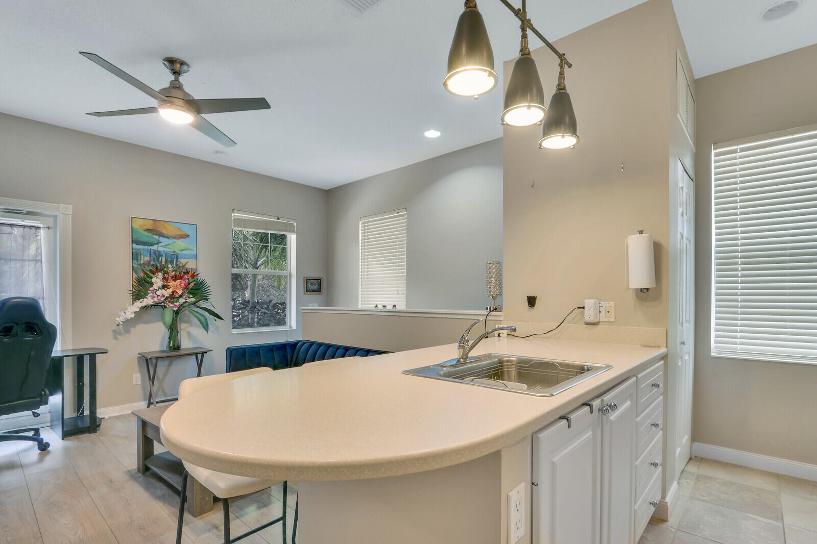 101 St Pierre Way Jupiter, FL 33458 - Photo 40 of 57 a kitchen with a sink a counter space and a chandelier