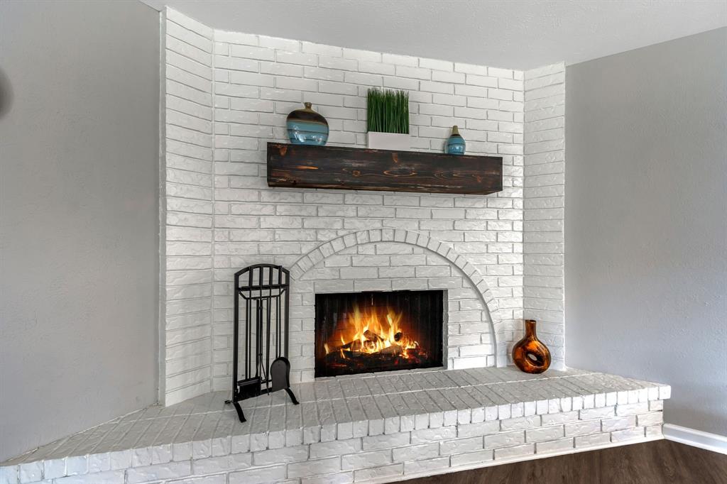 5652 Phelps Street The Colony, TX 75056 - Photo 12 of 29 a living room with furniture and a fireplace
