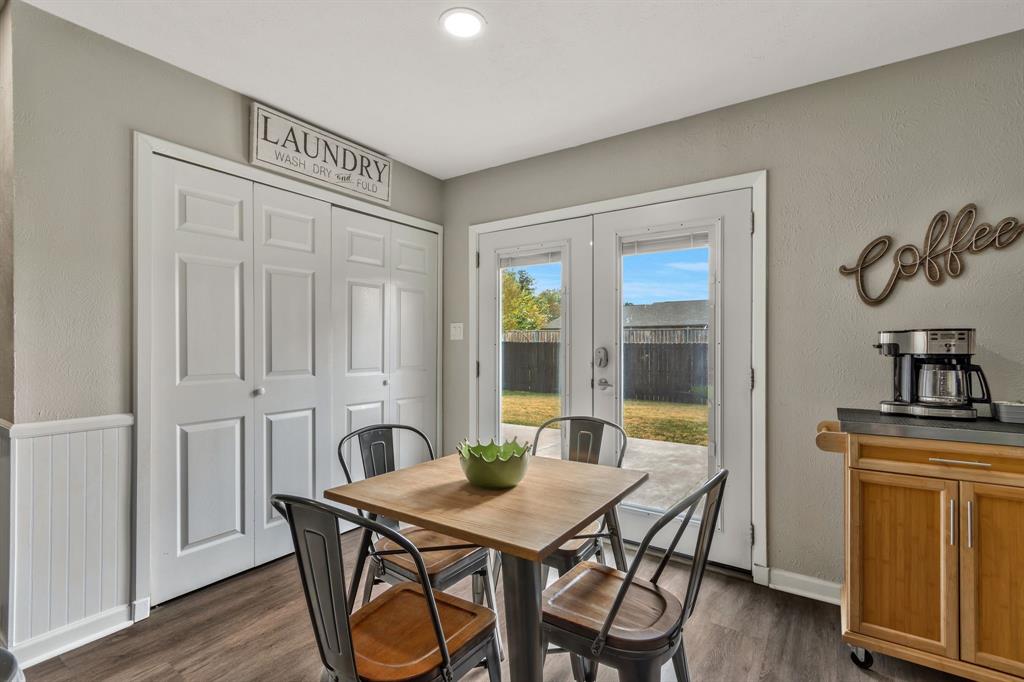 5652 Phelps Street The Colony, TX 75056 - Photo 17 of 29 a view of a dining room with furniture window and wooden floor