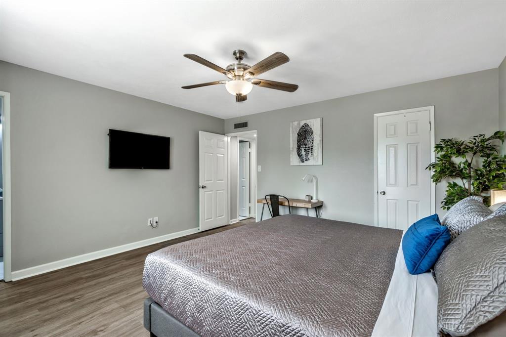 5652 Phelps Street The Colony, TX 75056 - Photo 20 of 29 a bedroom with a bed and a flat screen tv