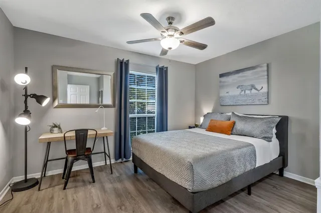 a bedroom with a bed and a table in it