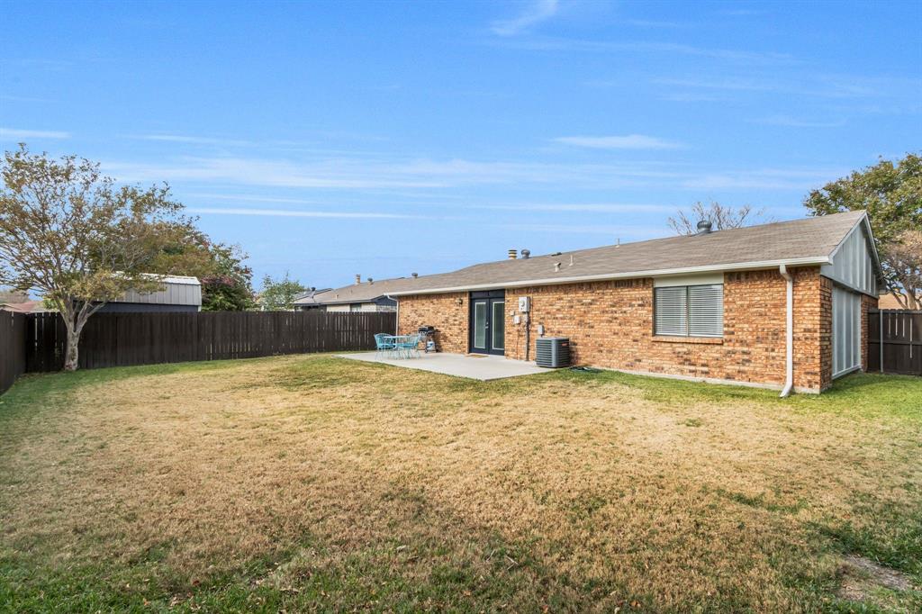 5652 Phelps Street The Colony, TX 75056 - Photo 27 of 29 a view of a yard in front of a house
