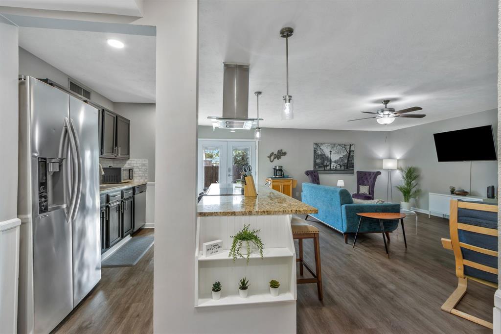 5652 Phelps Street The Colony, TX 75056 - Photo 7 of 29 a living room with furniture and a flat screen tv