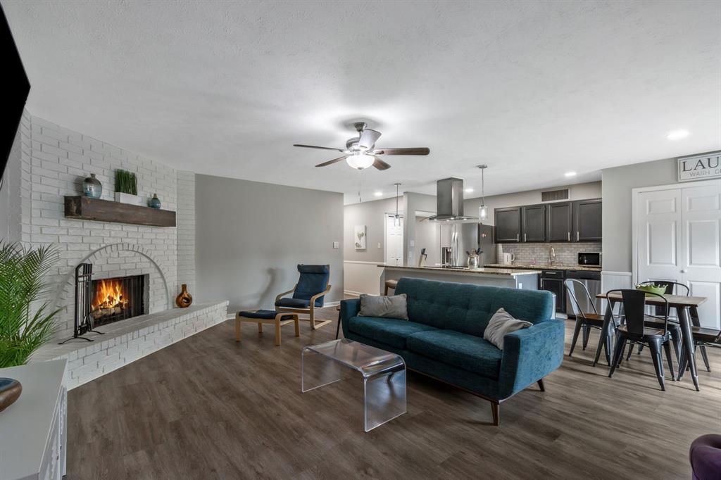 5652 Phelps Street The Colony, TX 75056 - Photo 10 of 29 a living room with furniture and a fireplace