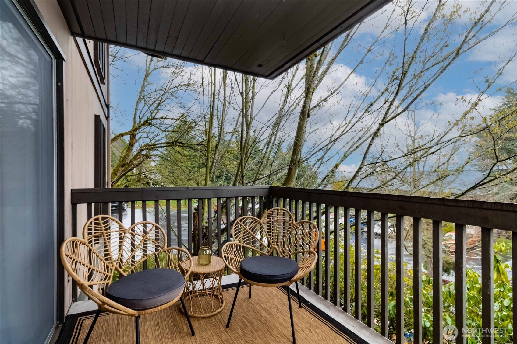 a view of a balcony with chairs