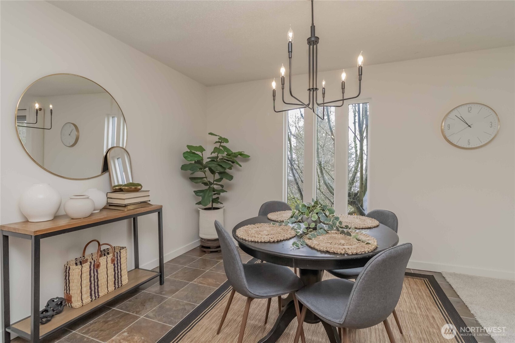 1425 South Puget Drive, Unit O4 Renton, WA 98055 - Photo 14 of 32 a view of a dining room with furniture and chandelier