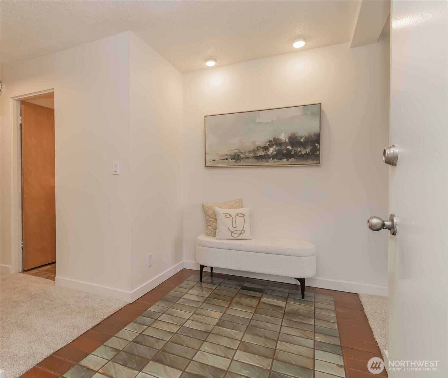 1425 South Puget Drive, Unit O4 Renton, WA 98055 - Photo 2 of 32 a view of a hallway with wooden floor and a bathroom