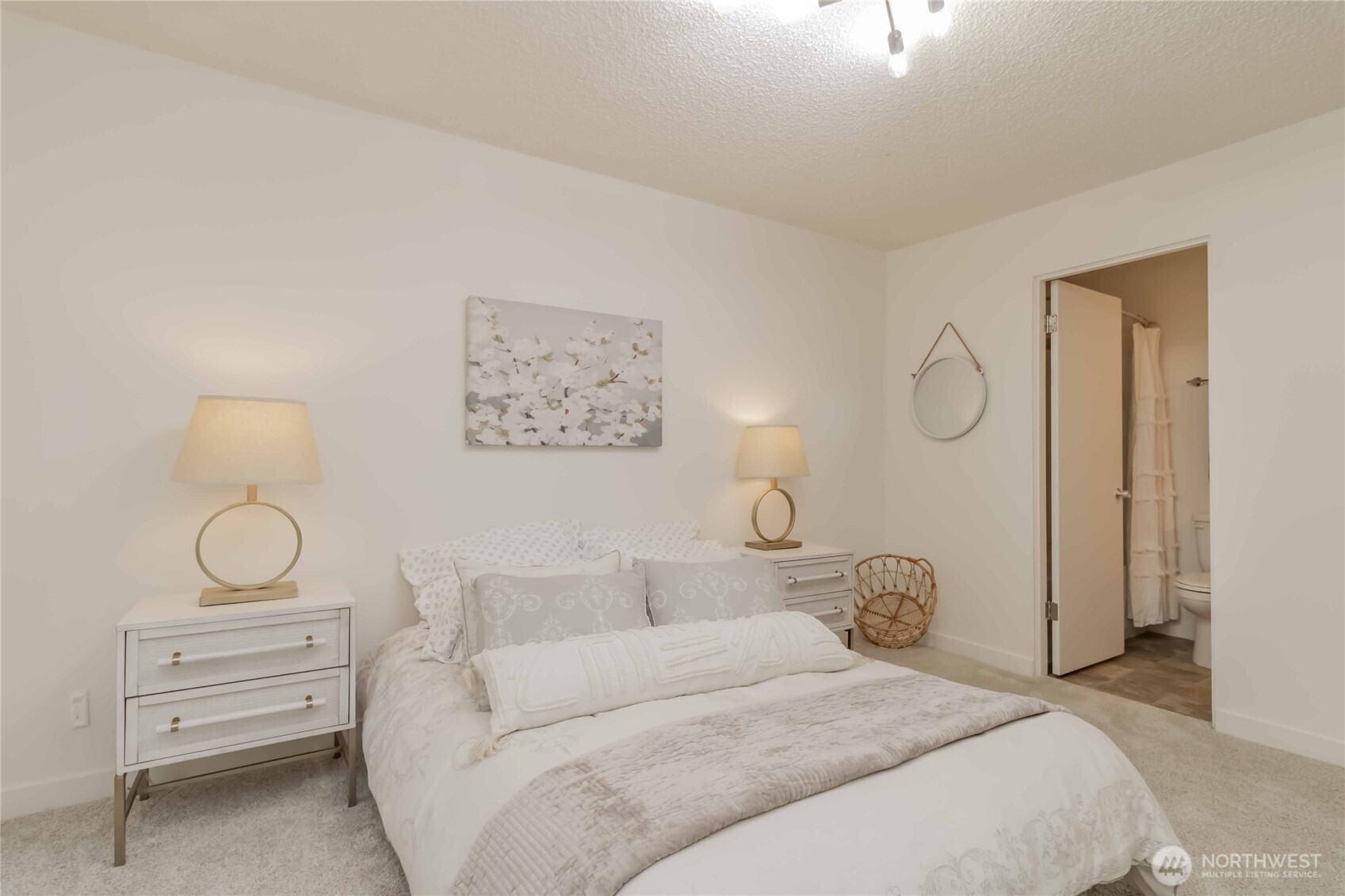 1425 South Puget Drive, Unit O4 Renton, WA 98055 - Photo 23 of 32 a bedroom with bed and a chandelier