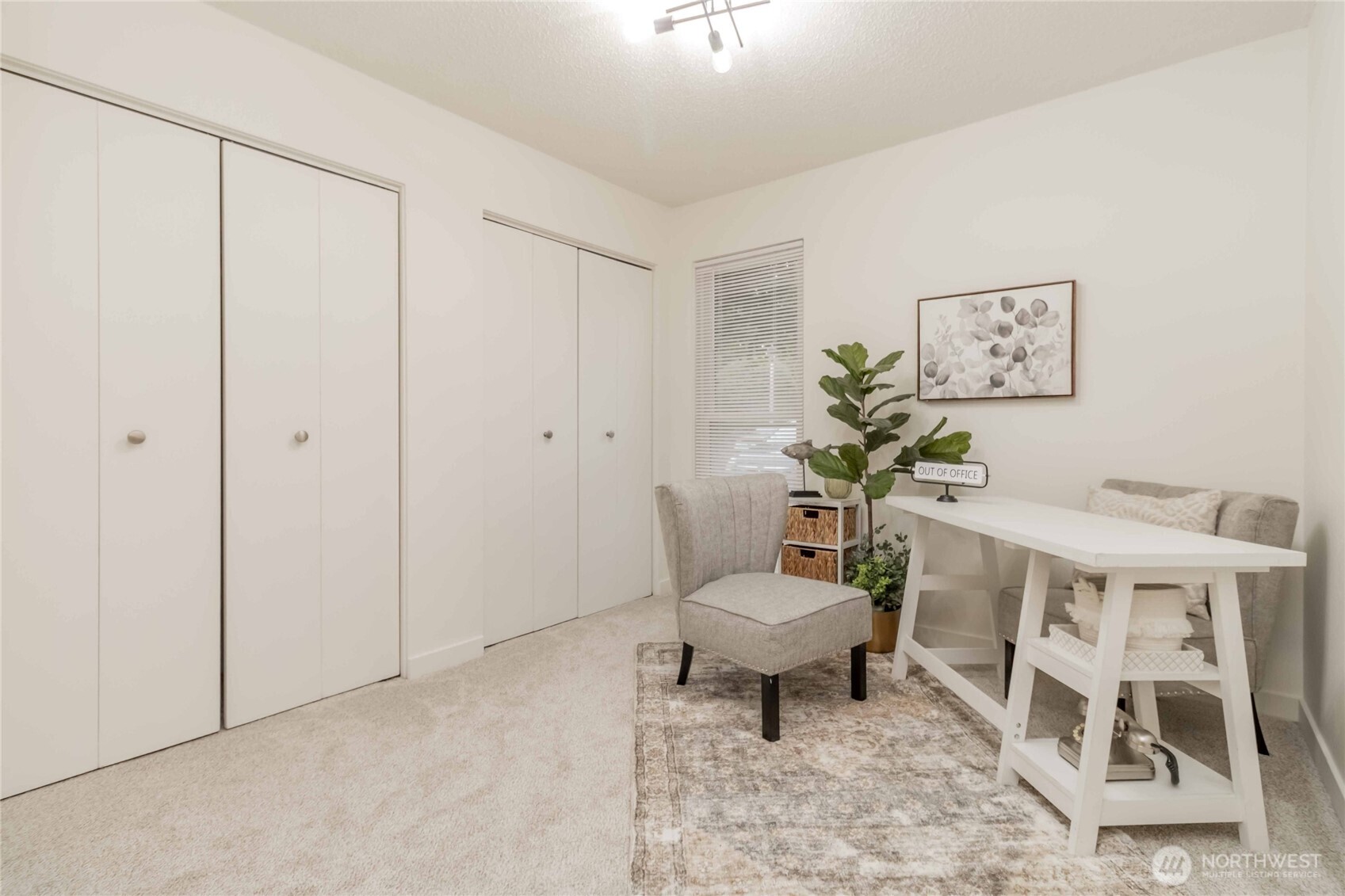 1425 South Puget Drive, Unit O4 Renton, WA 98055 - Photo 27 of 32 a living room with furniture a rug and a window