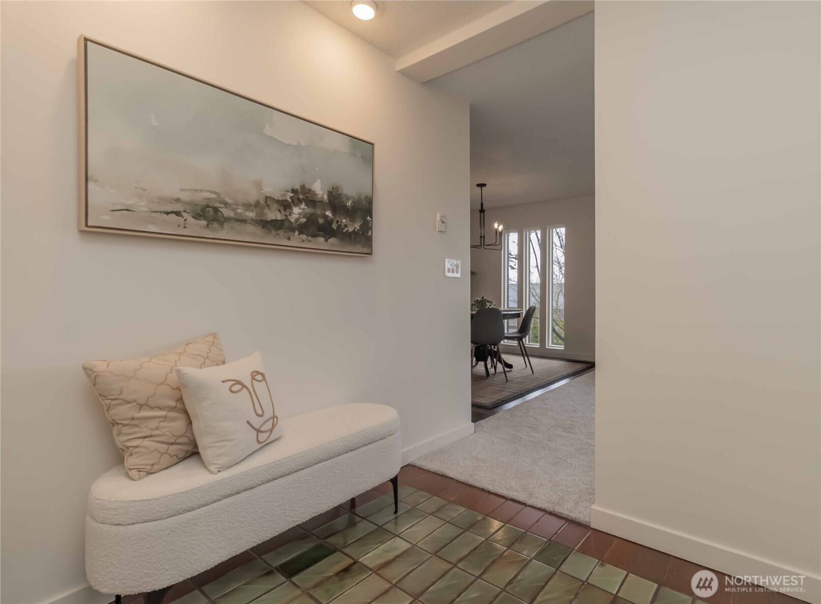1425 South Puget Drive, Unit O4 Renton, WA 98055 - Photo 3 of 32 a living room with furniture and a painting on the wall