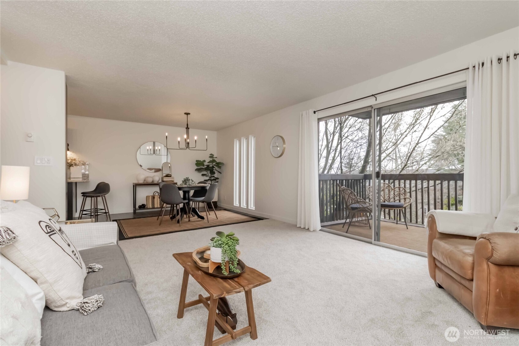 1425 South Puget Drive, Unit O4 Renton, WA 98055 - Photo 9 of 32 a living room with furniture and a large window