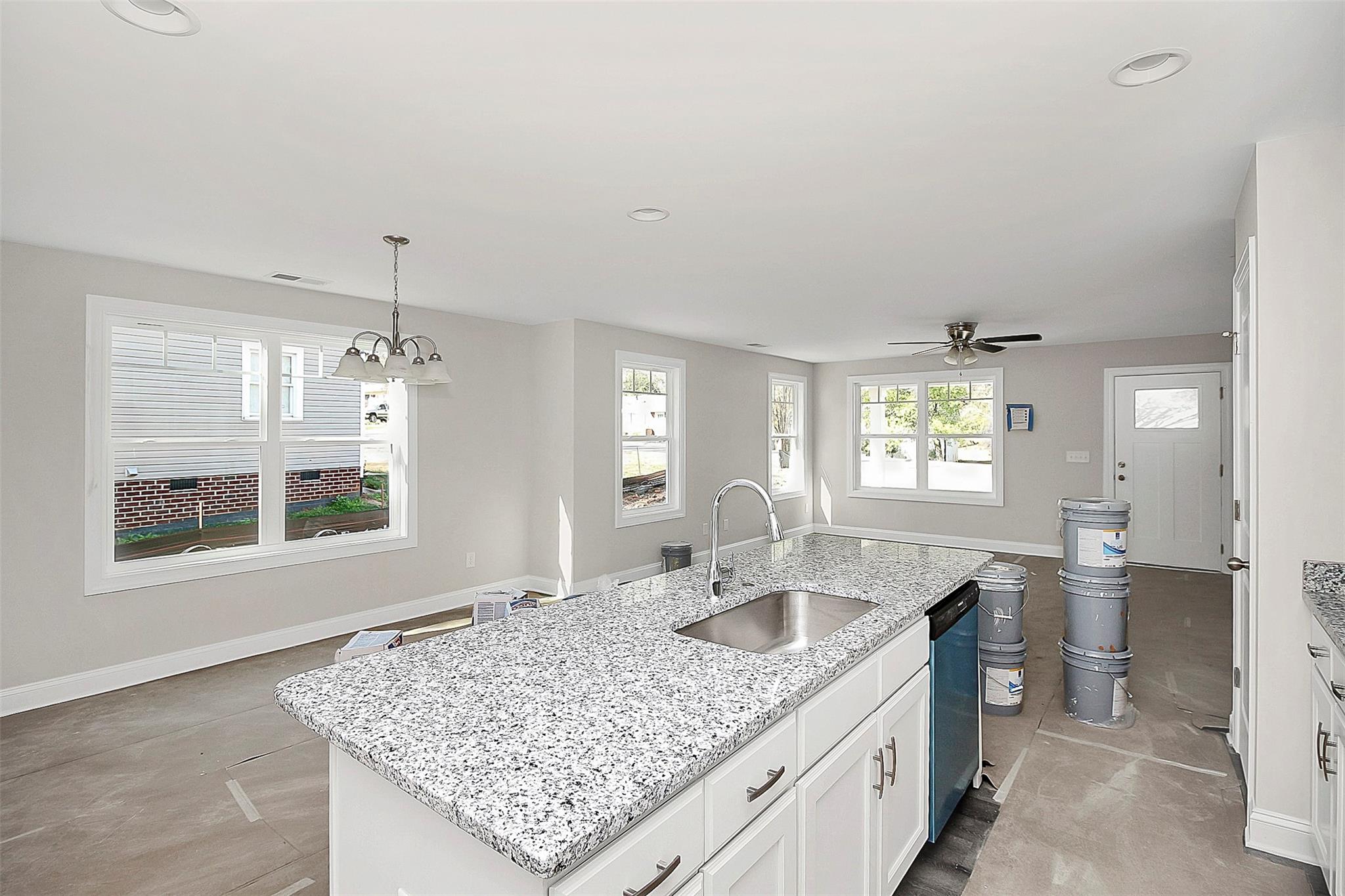 4412 Tillman Road Charlotte, NC 28208 - Photo 14 of 34 a kitchen with a sink granite counter tops and window