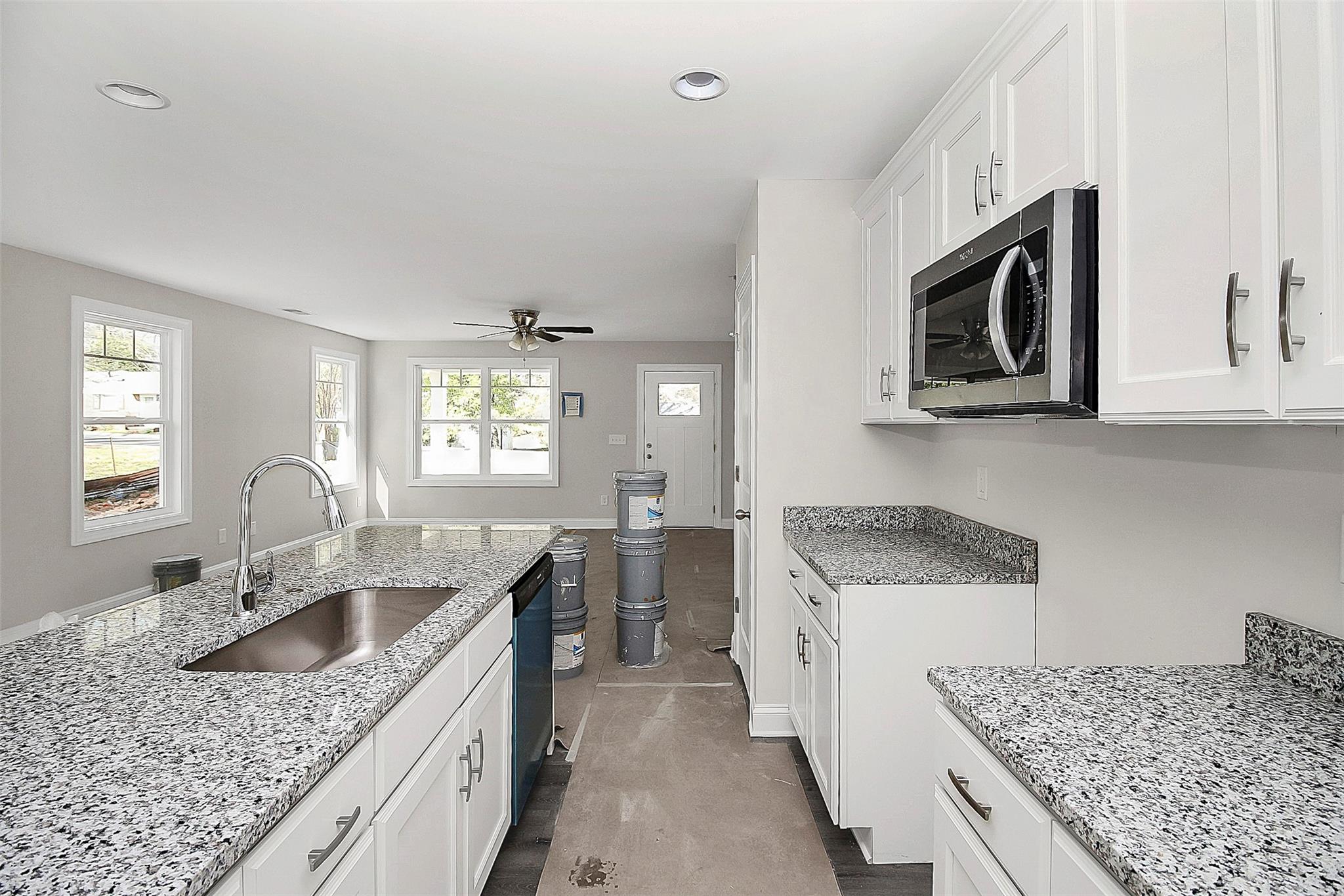 4412 Tillman Road Charlotte, NC 28208 - Photo 15 of 34 a kitchen with a stove sink and microwave