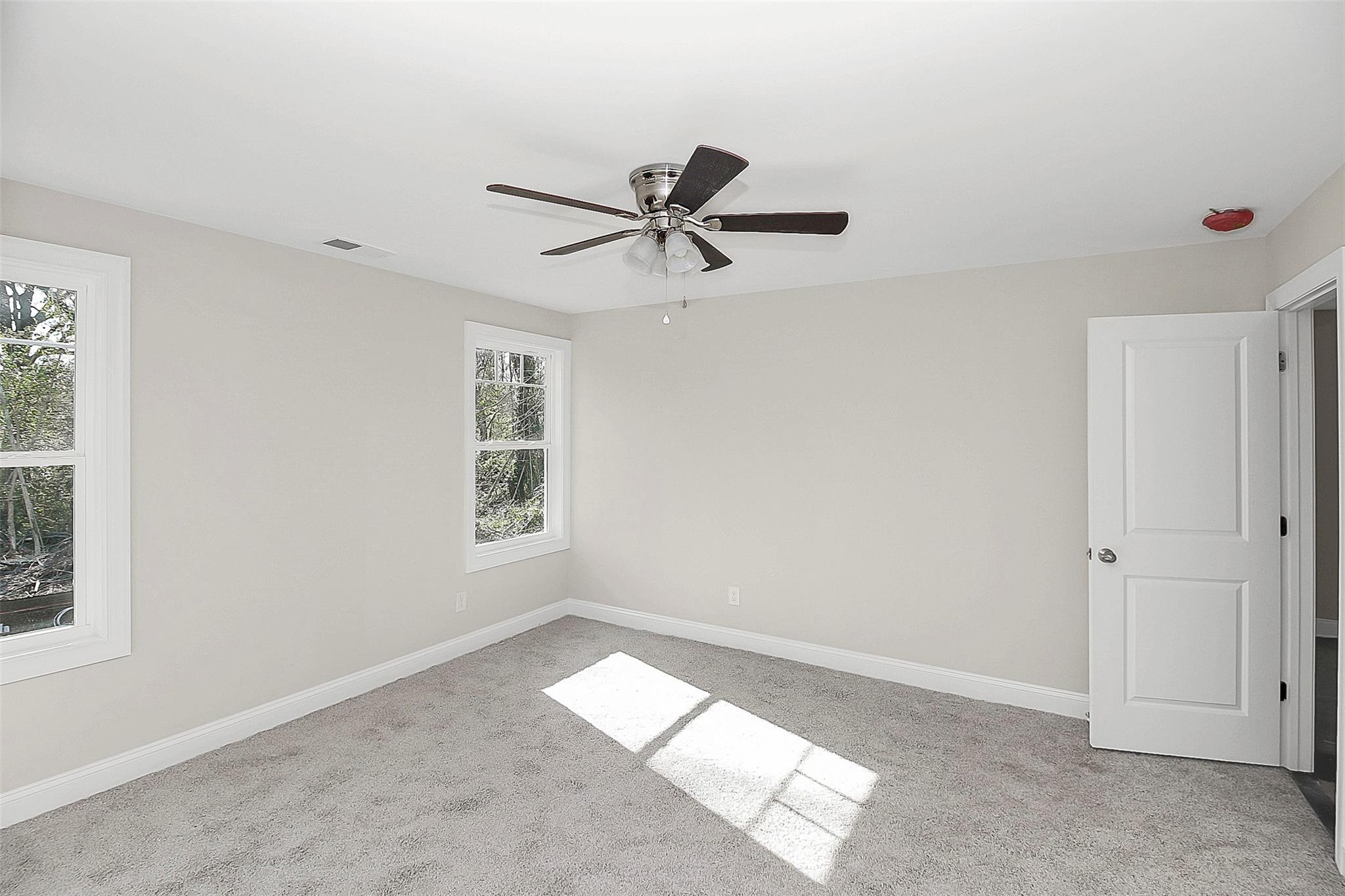 4412 Tillman Road Charlotte, NC 28208 - Photo 22 of 34 a view of a livingroom with a ceiling fan and window