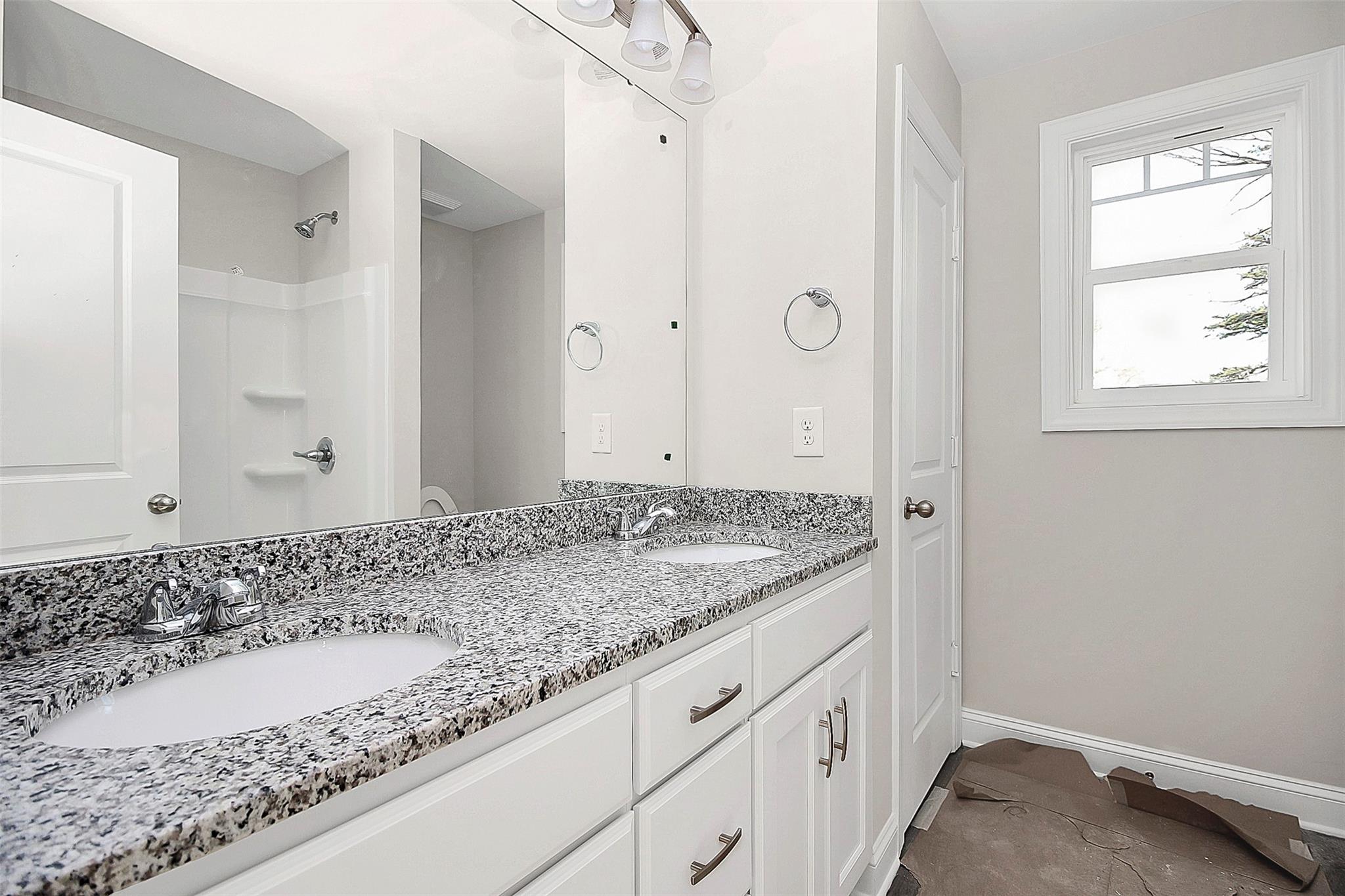 4412 Tillman Road Charlotte, NC 28208 - Photo 23 of 34 a bathroom with a granite countertop sink and a mirror
