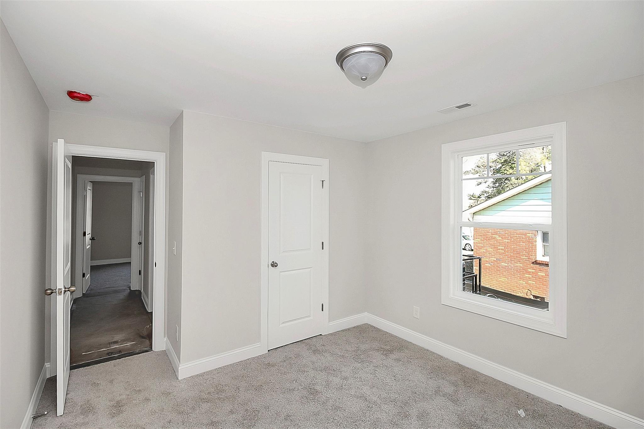 4412 Tillman Road Charlotte, NC 28208 - Photo 30 of 34 a view of an empty room with closet and a window