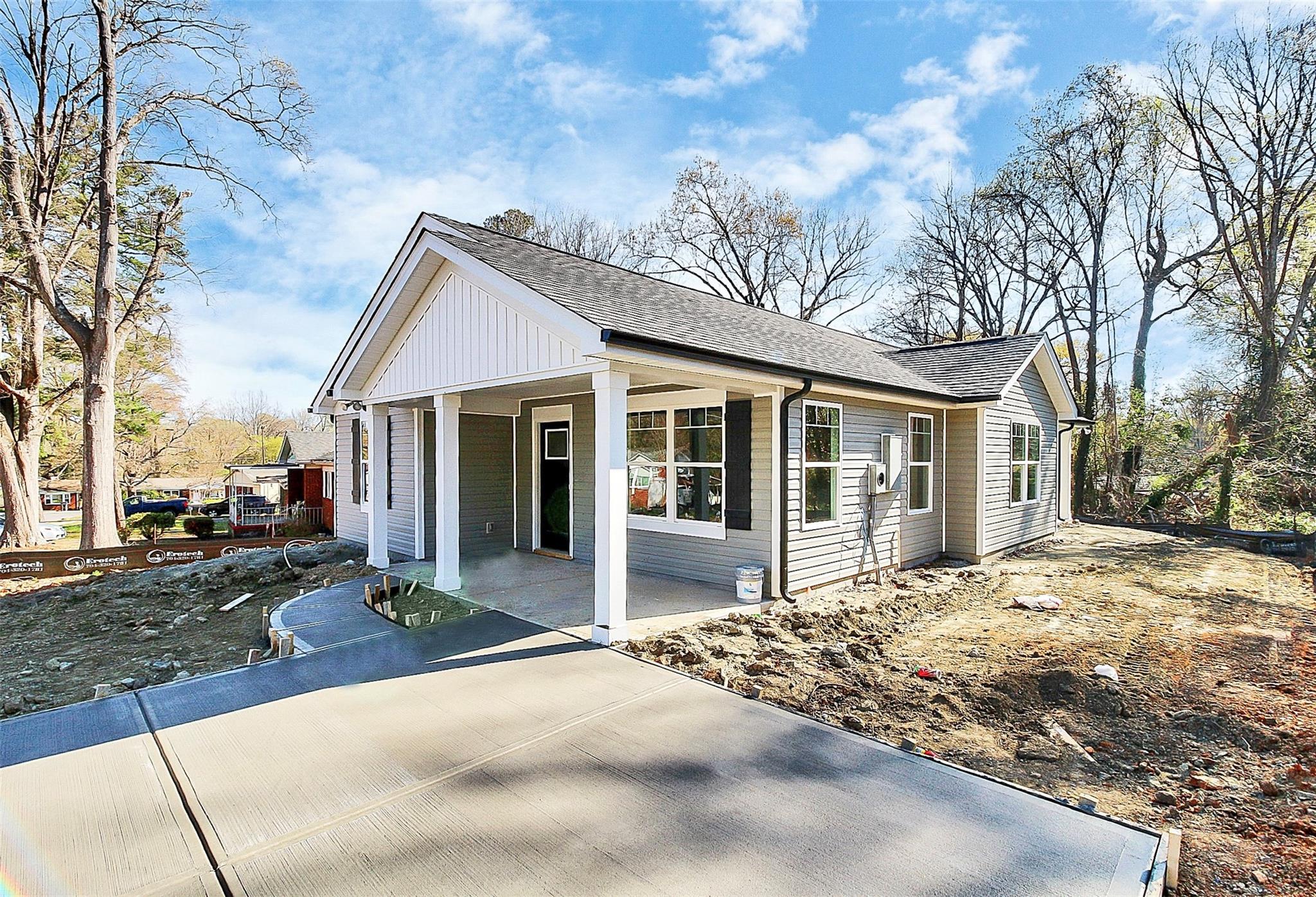 4412 Tillman Road Charlotte, NC 28208 - Photo 3 of 34 a front view of a house with a yard outdoor seating and pathway