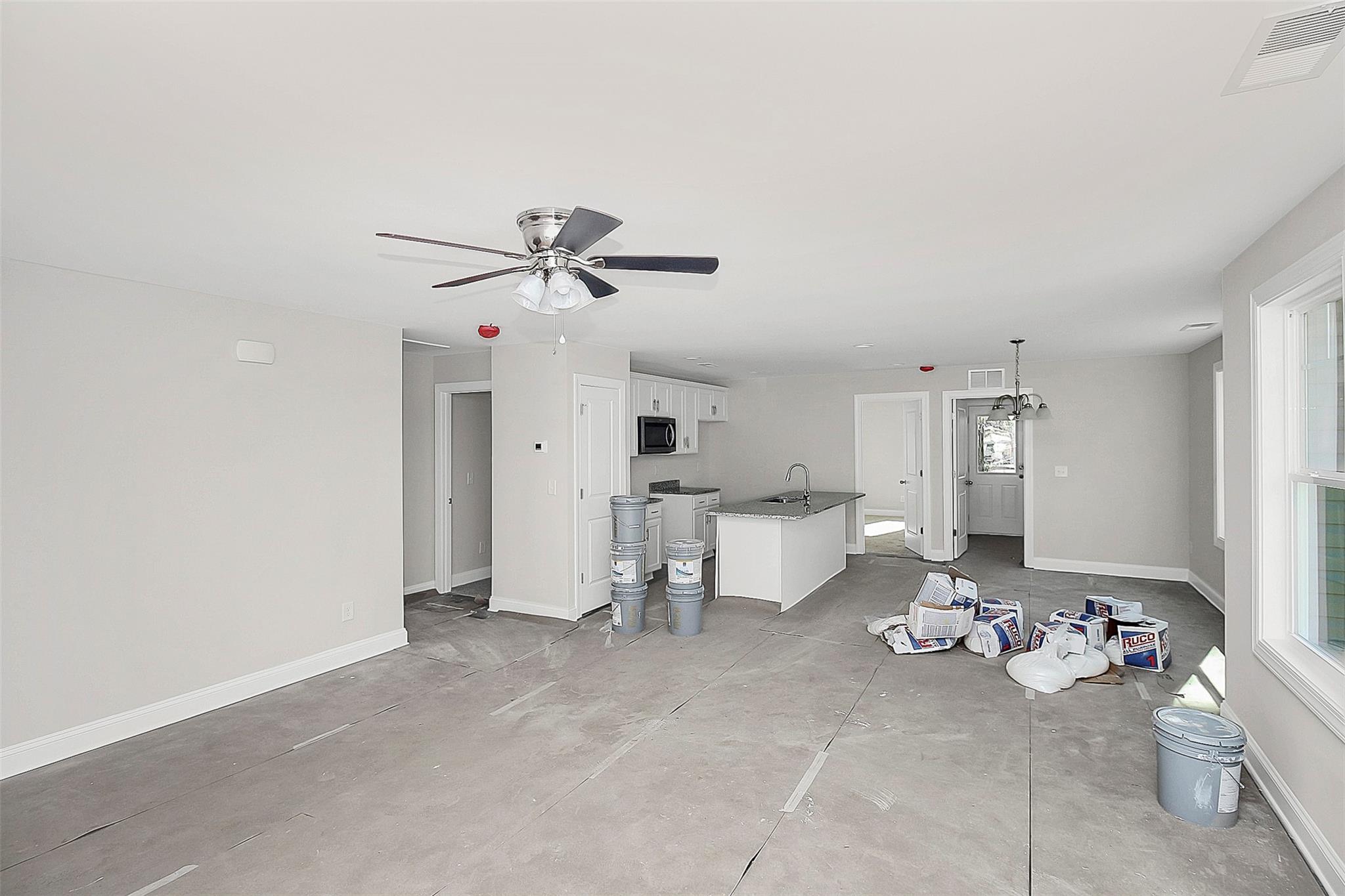 4412 Tillman Road Charlotte, NC 28208 - Photo 6 of 34 a living room with lots of white furniture and chandelier fan