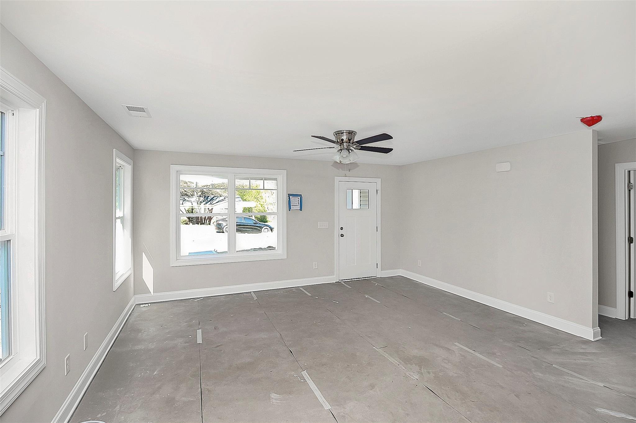 4412 Tillman Road Charlotte, NC 28208 - Photo 7 of 34 a view of an empty room with a window