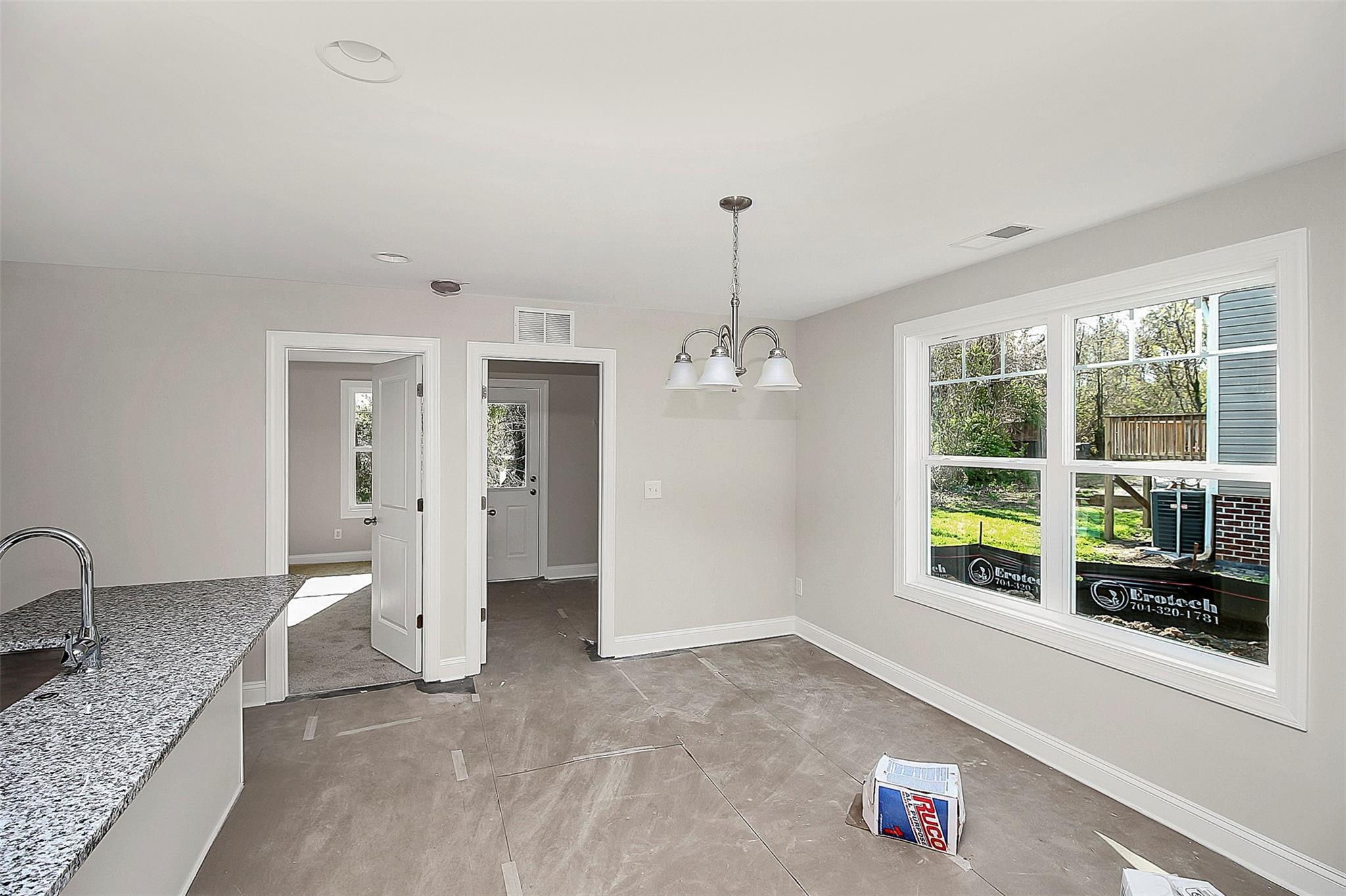 4412 Tillman Road Charlotte, NC 28208 - Photo 10 of 34 a view of an empty room with a window