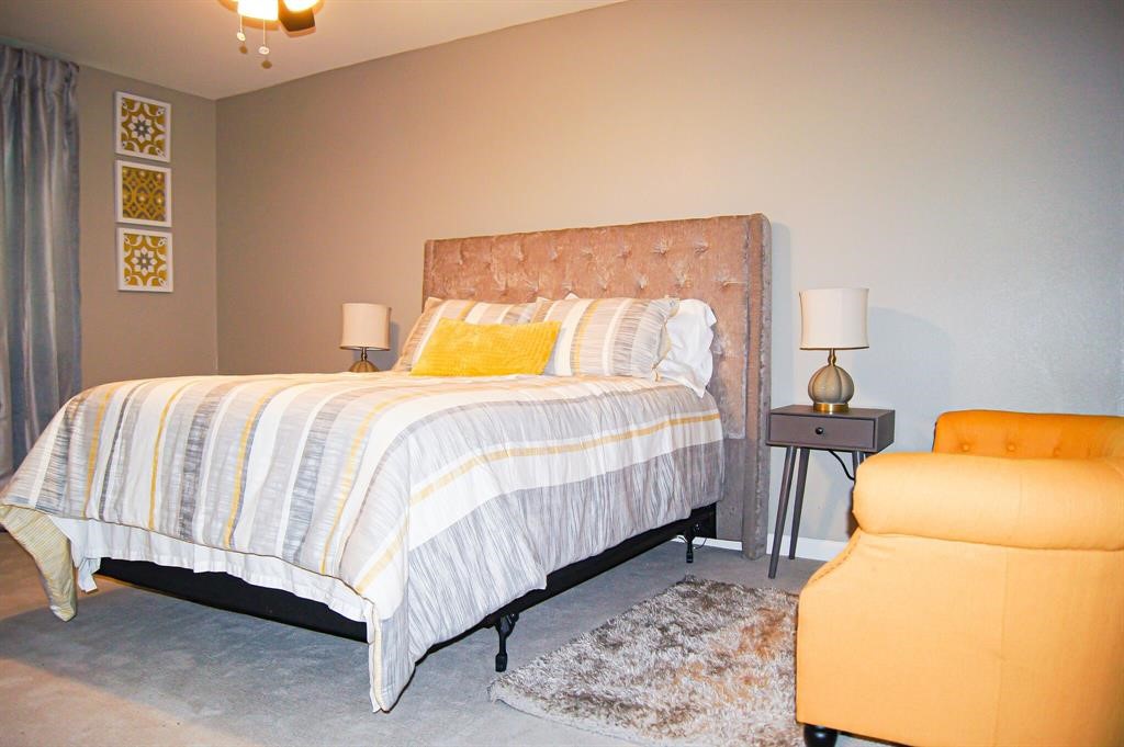 1727 Pueblo Street Dallas, TX 75212 - Photo 13 of 27 a bed room with a bed and a couch