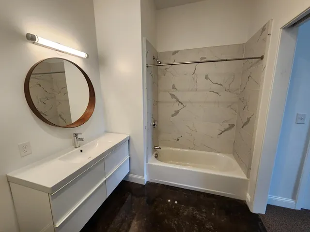 a view of a patio with dining table and chairs
