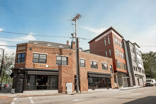 a front view of a house with outdoor seating