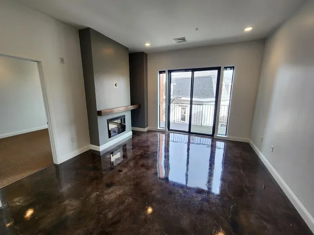 a kitchen with stainless steel appliances a refrigerator and a stove top oven