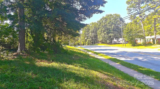a view of a yard with swimming pool