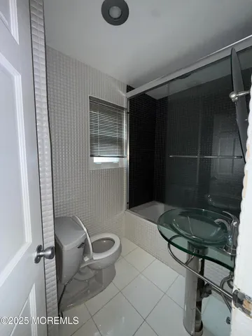 a bathroom with a toilet and a sink