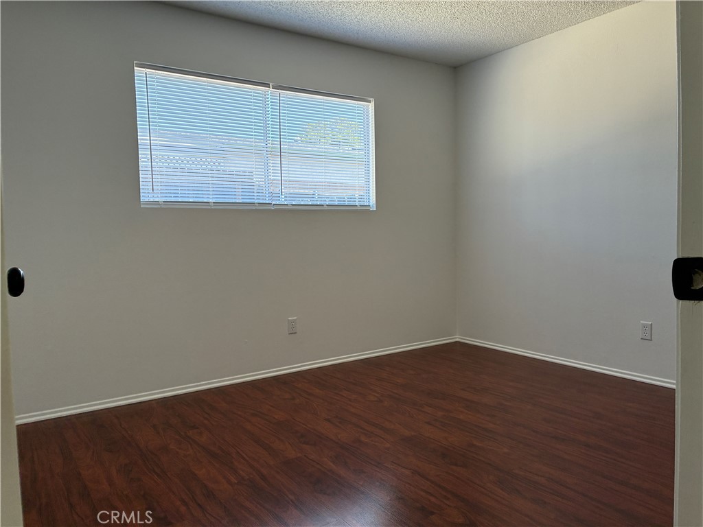 517 Queenanne Road Paso Robles, CA 93446 - Photo 8 of 18 Guest room has a nice big window to let in morning sun and light, pretty wood flooring and big closet.