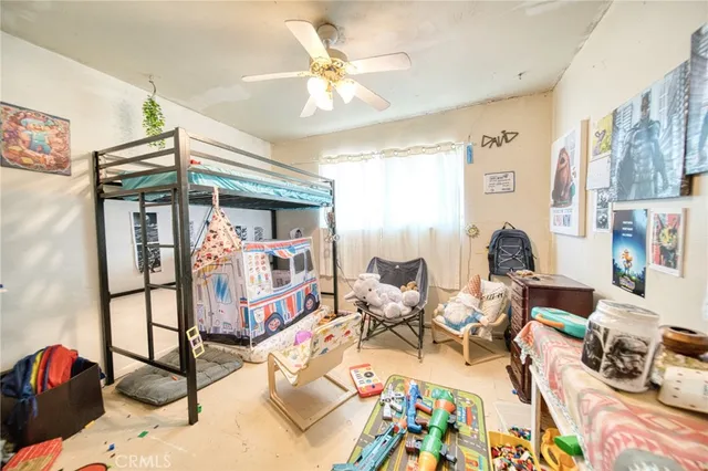 a bed room with furniture and a chandelier