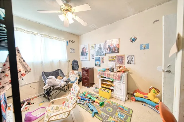 a bed room with a bed and a chandelier