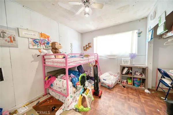 a bed room with a bed and a window