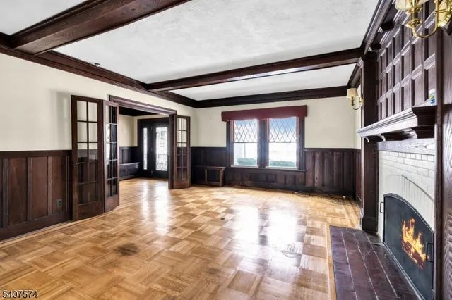 a view of an entryway with a fireplace and a window