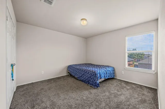 a room with a bed and a window