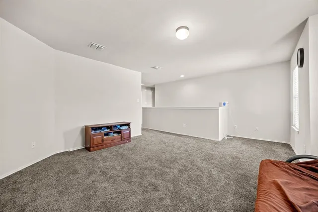 a view of an empty room with a hallway