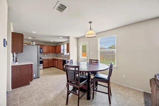 a view of a dining room with furniture