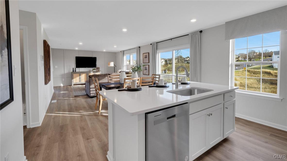 242 Winding Road Easton, PA 18040 - Photo 11 of 27 a kitchen with sink attached with living room