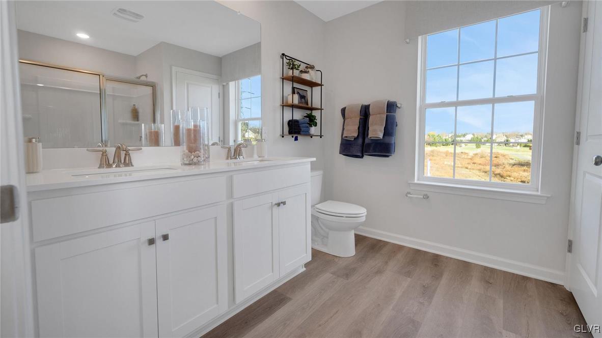 242 Winding Road Easton, PA 18040 - Photo 17 of 27 a bathroom with a toilet sink and mirror
