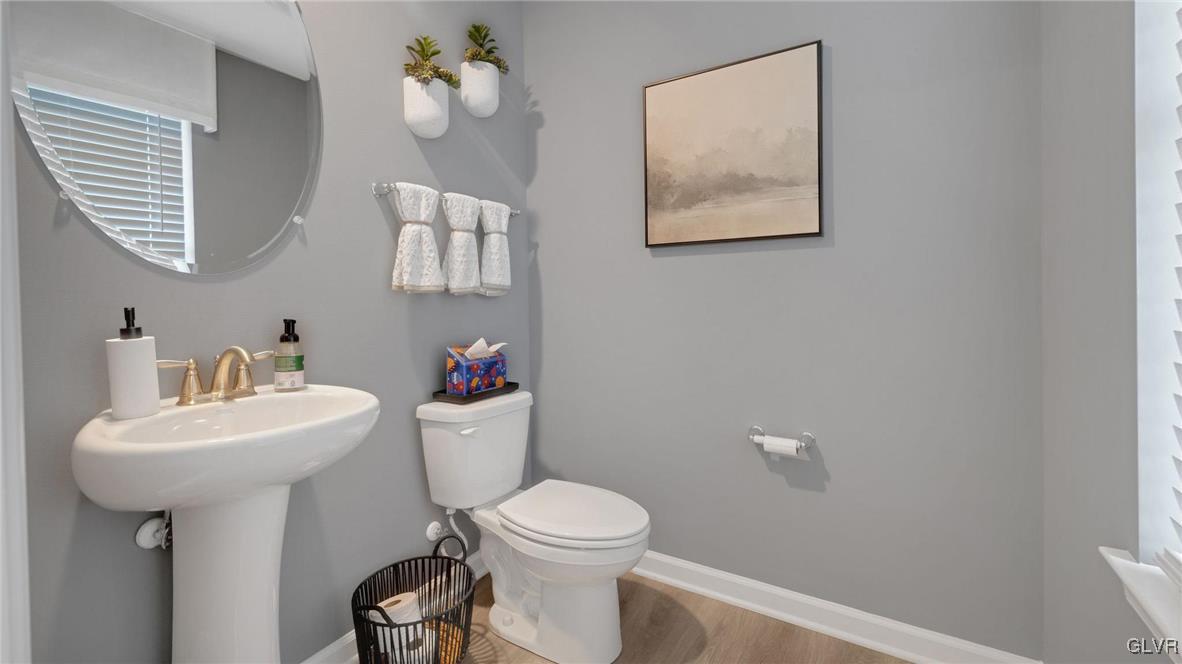 242 Winding Road Easton, PA 18040 - Photo 6 of 27 a bathroom with a toilet sink and mirror