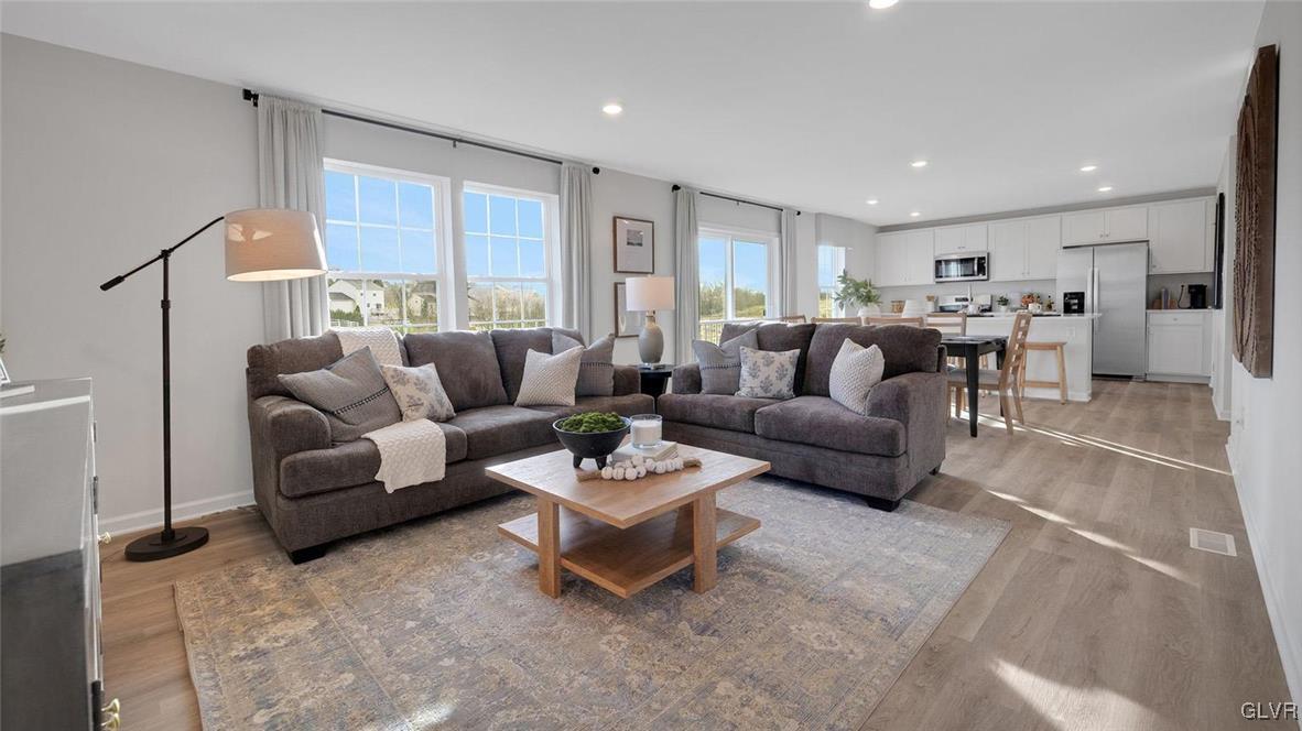 242 Winding Road Easton, PA 18040 - Photo 8 of 27 a living room with furniture and a table