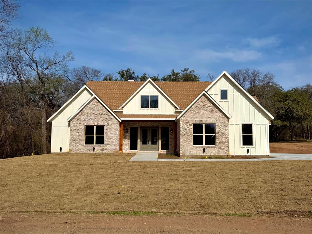 121 Canyon Ridge Drive Waco, TX 76705 - Photo 1 of 1 a front view of house with yard and trees in the background