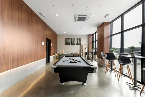 a room with furniture and a large window