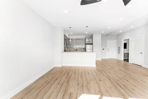 a view of kitchen with wooden floor