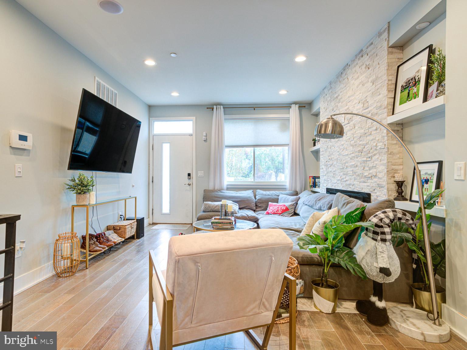 2639 Jasper Street Philadelphia, PA 19125 - Photo 1 of 23 a living room with fireplace furniture and a flat screen tv