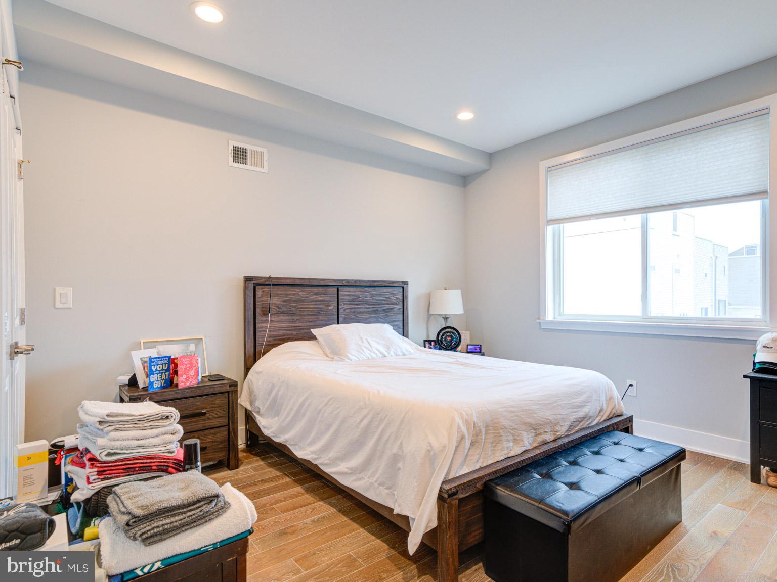2639 Jasper Street Philadelphia, PA 19125 - Photo 12 of 23 a bedroom with a bed and a window